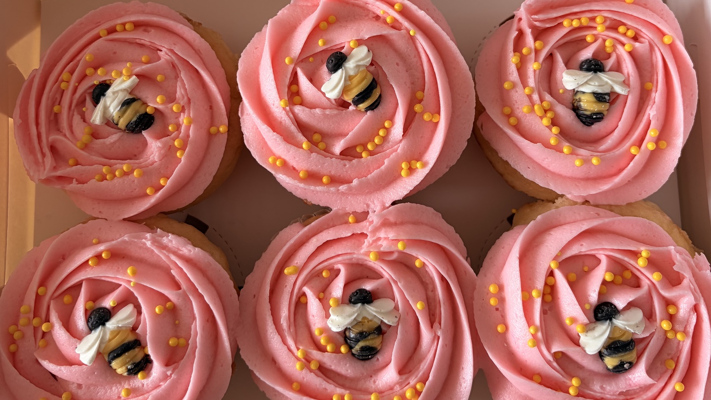 Bee cupcakes with pink frosting